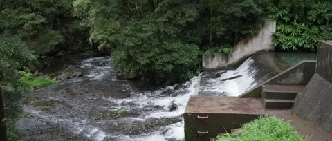 A static shot of water flowing from a dam Video stock 321200484