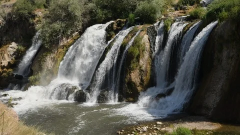 Static shot of water flowing over the Muradiye Waterfall, Van, Turkey Stock Footage 104606528