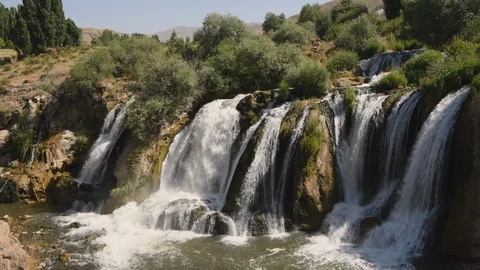 Static shot of water flowing over the Muradiye Waterfall, Van, Turkey Stock Footage 104610580