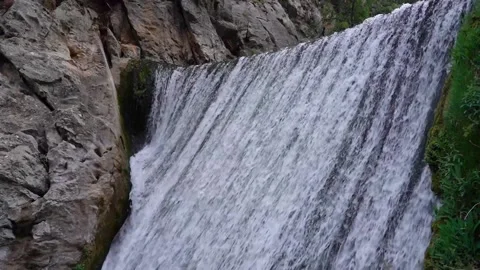 Static shot of waterfall top part with rocks and water flowing Stock Footage 136580945