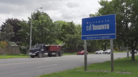 Static shot of welcome to Toronto sign beside a road Stock Footage 252153534