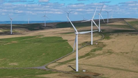 Static Shot of Wind Farm with Turbines Generating Clean Electricity Video stock 336959904