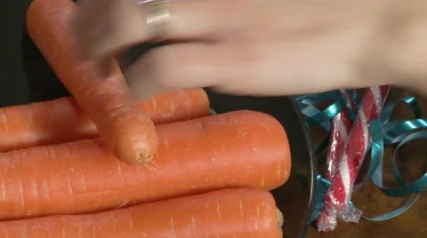 Static Shot of a Woman Taking a Bite Out of a Carrot Stock Footage 56648373