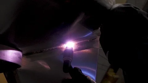 Static shot of worker welding stainless steel part, using TIG, MIG, Stock Footage 119588119
