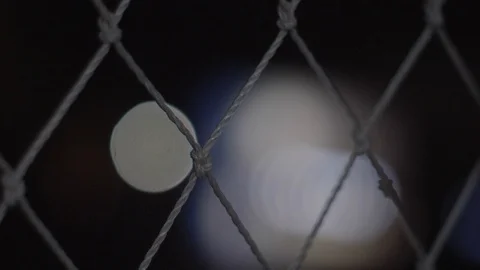Static shot of woven string mesh netting in night light environment. Stock Footage 108552082
