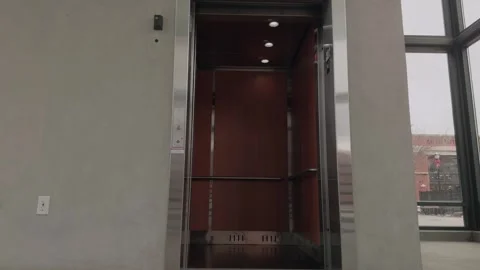 Static Slow Motion Elevator Doors Opening and Closing in Modern Interior Stock Footage 327340573