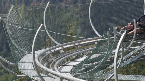 Static slow motion FHD shot of a man riding a roller coaster cart in on Stock Footage 138124376