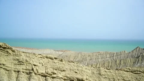 Static slow motion shot of the ocean with calm waves reaching the shore of a Stock Footage 284445595