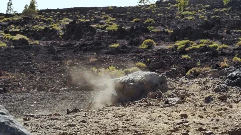 Static slow-motion shot of rock crashing and exploding into pieces Stock Footage 142769079