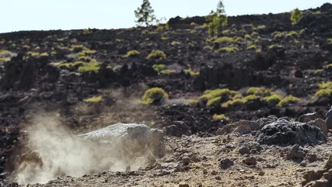 Static slow-motion shot of rock crashing and exploding into pieces Stock Footage 142772444