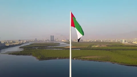 Static slow motion view of UAE flag and Ras al Khaimah emirate in the north U Stock Footage 154534158