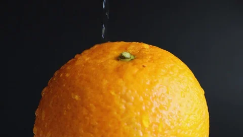 Static still wet all orange close-up with splashes of water, 4k video Stock Footage 127653214