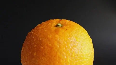 Static still wet orange with drops of water close-up. Stock Footage 127654355