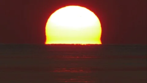 Static Tight shot of Sun Disappearing Over the Horizon Stock Footage 82879586