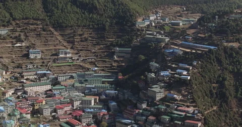 Static tilt up drone shot of Namche Bazaar Nepal revealing Ama Dablam and Stockbeeldmateriaal 337395419