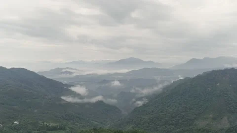 Static time lapse. Aerial drone shot of mist or fog spreading over green hill Video stock 188517676