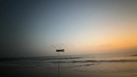 Static Time-lapse of Professional Lighting Gear on Sunset Beach Stock Footage 329341838