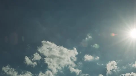 Static time lapse of whispy white clouds rolling across a vibrant blue Video stock 233065647