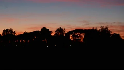 A static timelapse at sunset with a dramatic cloudy sky and contrasty blue 스톡 동영상 167697124