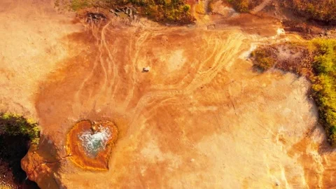 Static top down aerial view orange heart shape form mineral hot spring site i Video stock 164521369