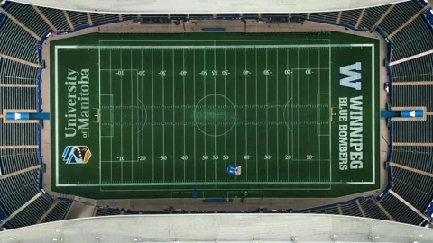 Static top-down drone shot of Princess Auto Stadium football field in Winnipeg Stock Footage 313914199