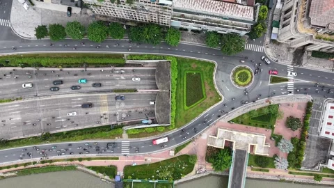 Static top down hold over a city underpass and roundabout in Ho Chi Minh City Stock Footage 344906567