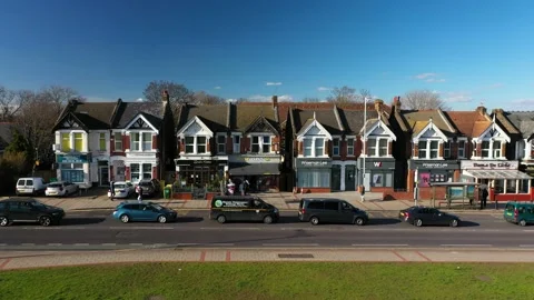 STATIC TRAFFIC OF UK SMALL TOWN DURING SUNSET AERIAL Video stock 149857639