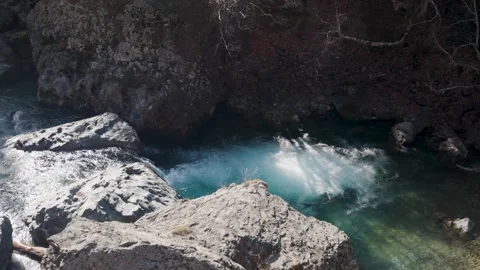 Static Tripod Shot of Turquoise Glacial River Flowing Between Granite Rocks 스톡 동영상 330440670