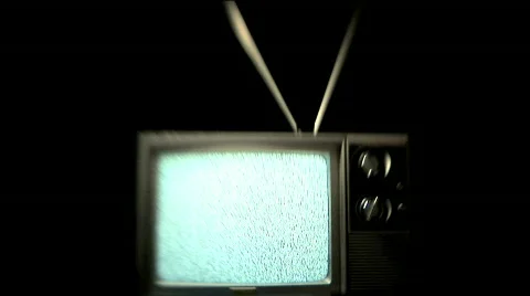 Static TV - Snow Playing on Retro Television with Rabbit Ears Antenna Stock Footage 122865