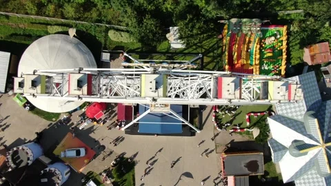 Static vertical shot above amusement park ferris wheel Stock Footage 322529098