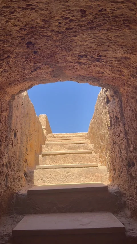 Static vertical shot looking up stone stairs from an underground tunnel Stock Footage 337371935