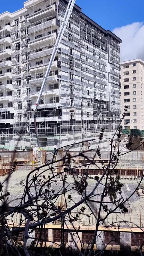Static vertical shot of a modern residential building under construction with Video stock 335998330