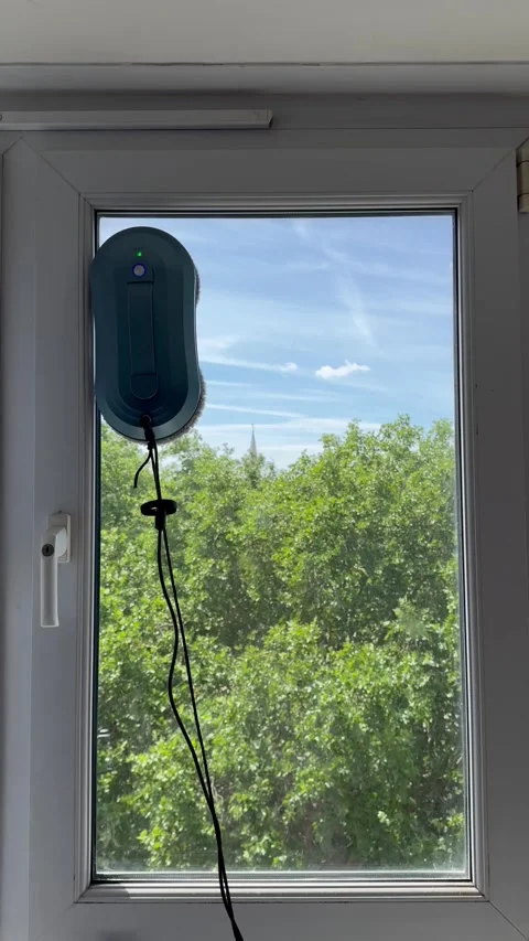 Static vertical shot of professional window cleaner washing top part of window Stock Footage 336907258