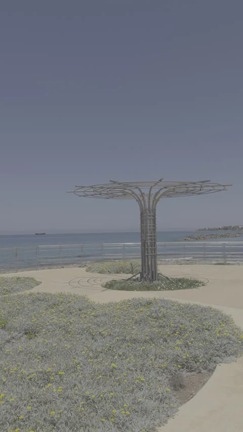 Static vertical shot of raw log footage of modern metal tree sculpture Stock Footage 336637304