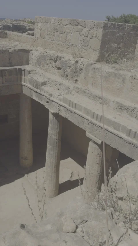 Static vertical shot of raw log footage looking down at underground tomb columns Stock Footage 336639035