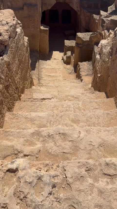 Static vertical shot of stone steps leading down into a dark underground cave Stock Footage 337370118