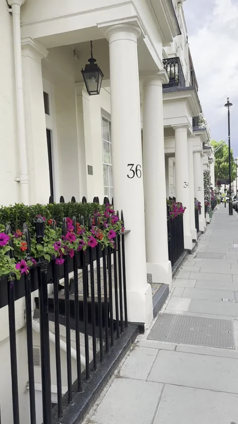 Static vertical shot of white columns and residential facades on London street Video stock 336680156