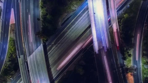 Static vertical top down aerial view of traffic on freeway interchange at night. Stock Footage 72687297
