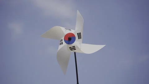 A static video of a Korean flag pinwheel rotating with different speed thanks Stock Footage 296616933