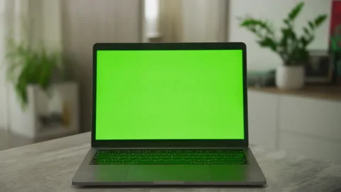 Static video of an open laptop computer with a green screen chromakey on it Stock Footage 157290992