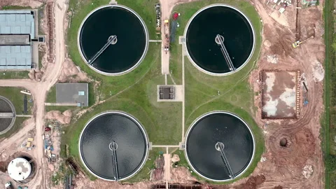 Static view from above on water treatment circles. Birds flying around. Top down Stock Footage 141011997