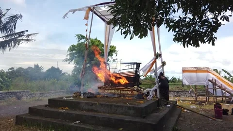 Static View of Balinese Cremator Poking the Burning Coffin Bali Funeral Stock-Footage 237508964