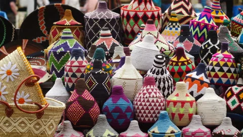 Static view of decorative colourful african ethnic objects placed in a Stock Footage 239055628