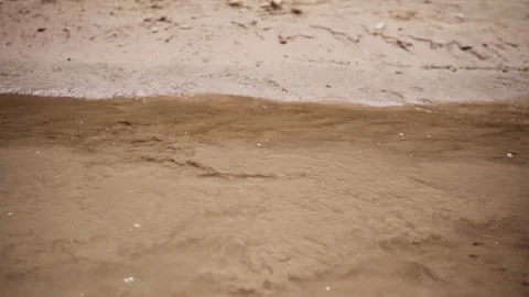 Static view of dirt swirling in a muddy shallow stream Video stock 93729490