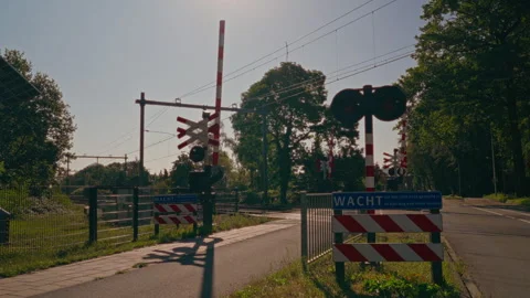 Static View of Dutch Railway Crossing With Red White Barrier and Level Crossing Stock-Footage 345551986