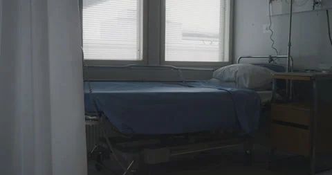 Static view of empty bed in a hospital, ready to receive patients. Daylight Stock Footage 272453113