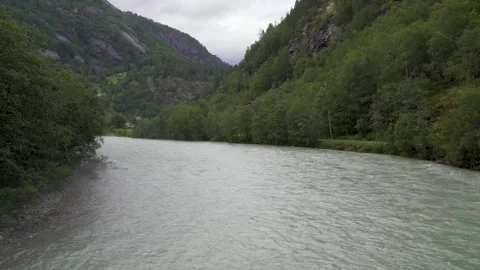 Static view of the Jostedla River in Gaupne, Norway showing the water flowing Stock Footage 321710733