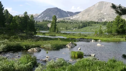 Static view to mountain lake and brook. Altai Video stock 84697281