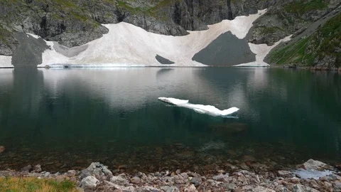 Static view to mountain lake with floe. Altai Stock Footage 103378850