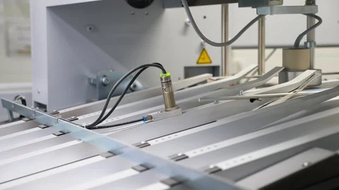 A static view of numerous sheets of printed papers moving through rollers Stock Footage 117292431